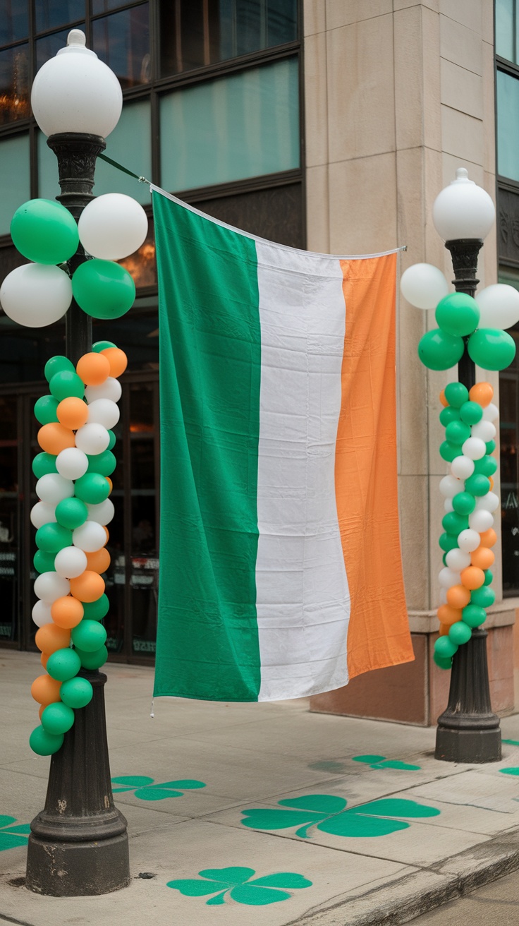 An Irish flag banner hanging with green, white, and orange balloons on lampposts.