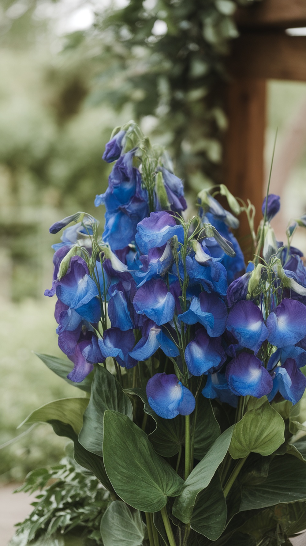 A bouquet of butterfly pea flowers and greenery, showcasing vibrant blue blooms.