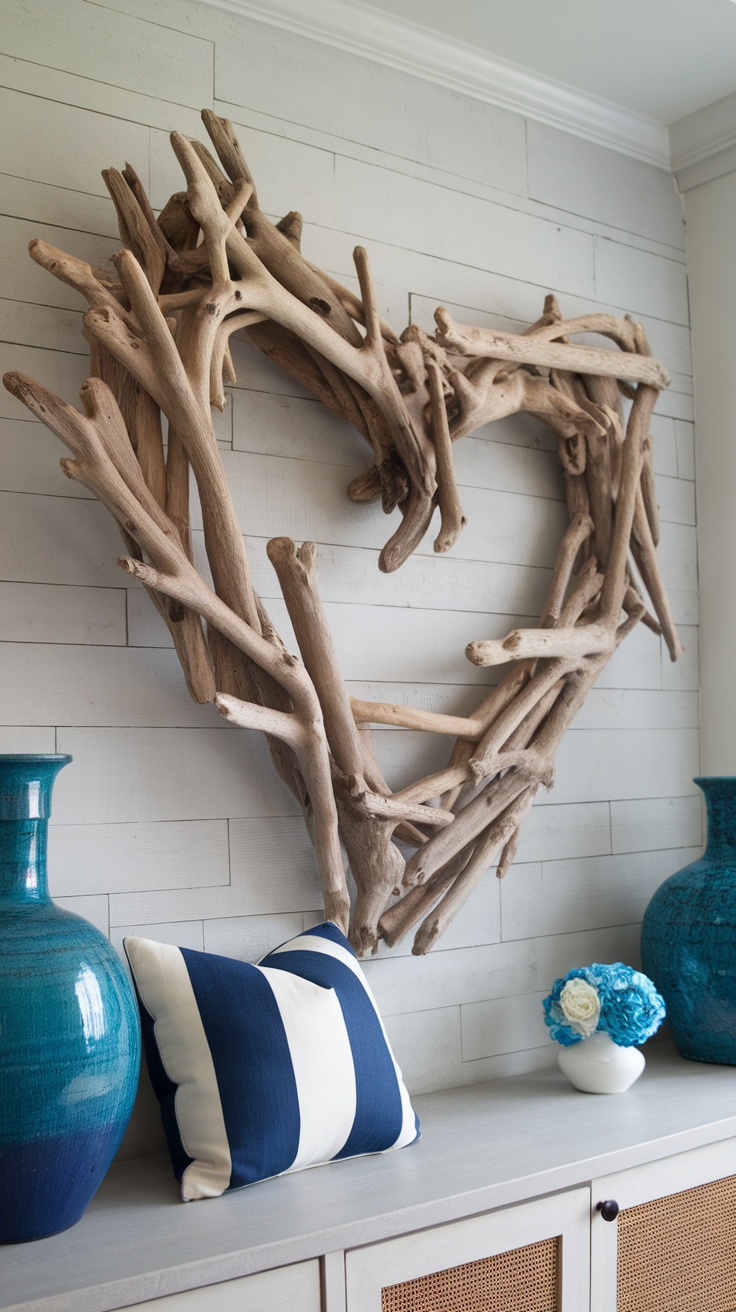 An artistic heart-shaped arrangement made of driftwood mounted on a light wood panel wall, complemented by blue vases and a striped pillow.